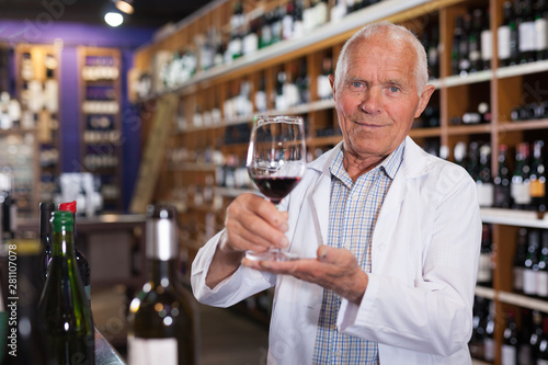 Winemaker offering glass of wine for tasting