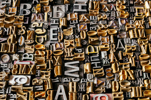 Dusty old metal letterpress type pieces background