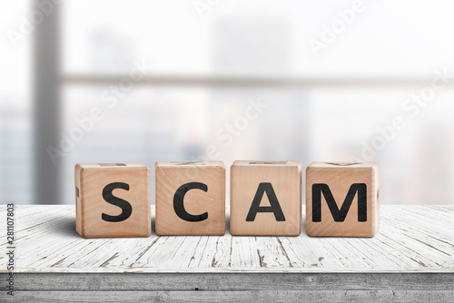 The word scam made of wooden blocks