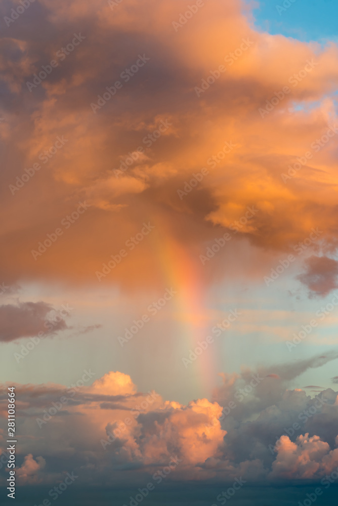 Rainbow and fantastic clouds at sunset,,natural composition