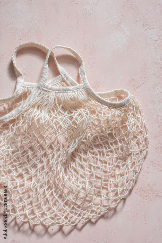 Fototapeta premium Empty reusable shopping bag on pink.