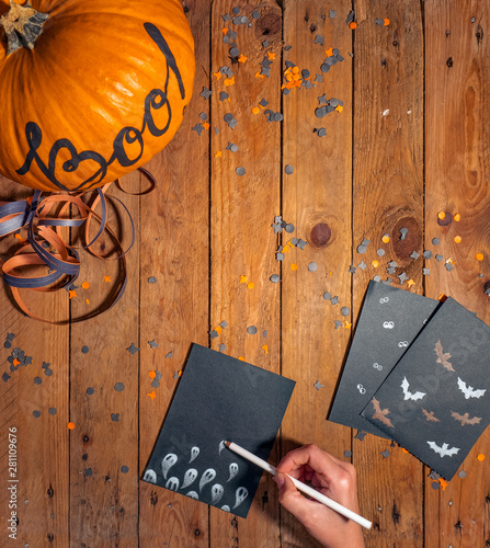 Woman drawing Halloween cards photo