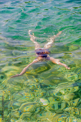 Young girl swiming in the sea
