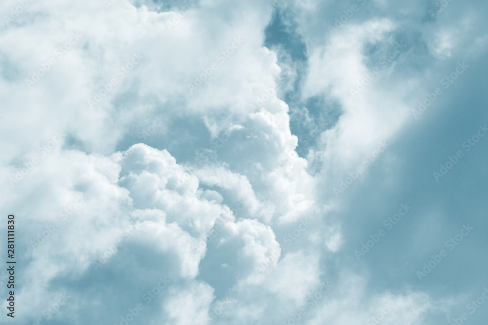 Soft fluffy blue clouds in the sky. Sunlight, light and shadow. natural background Soft fluffy blue clouds in the sky. Sunlight, light and shadow. natural background