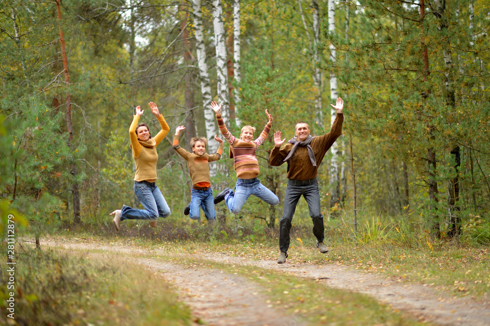 Portrait of family of four in park Portrait of family of four in park