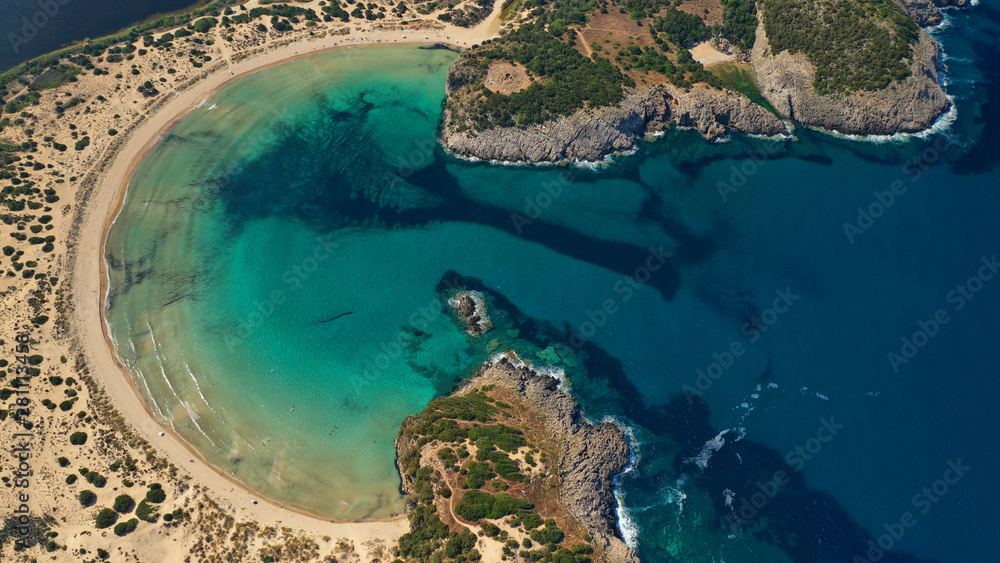 Aerial drone photo of Caribbean exotic paradise round shaped sandy bay with amazing turquoise and sapphire colours 
