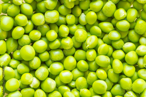 Light-green fresh peas peeled from pods. Background. © Jekh