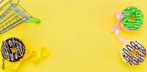 donuts on a yellow background and space for text.