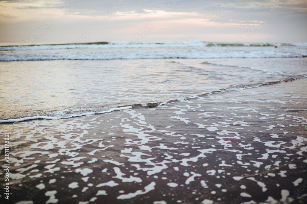 Fototapeta premium Wave of the sea on the sand beach
