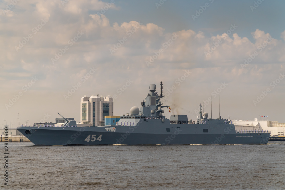 Military frigate runs along Kronstadt during the celebration of the Day of the Navy. 28 July 2019.