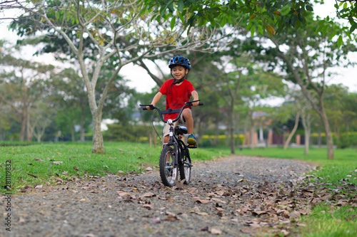 Cheerful Little Boy Riding a Bike