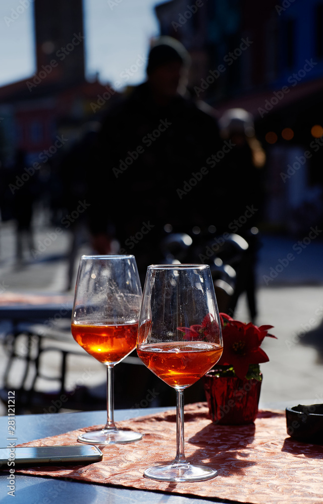 Two glasses with orange cocktail