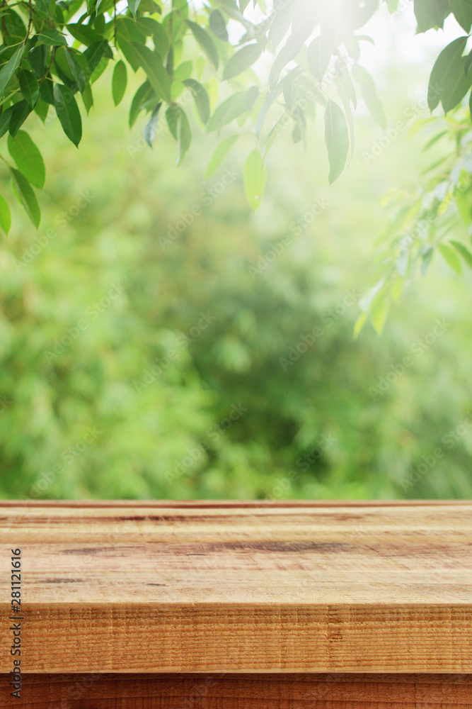 Wooden table and blurred green leaf nature in garden background. Wooden table and blurred green leaf nature in garden background.