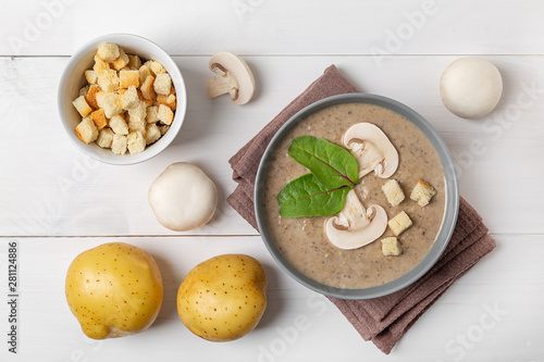 mushroom cream soup on white wooden board. Top view
