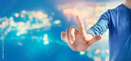 Man pointing something on blurred city background