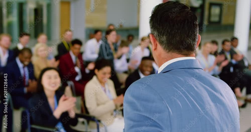 male speaker speaks in a business seminar male speaker speaks in a business seminar