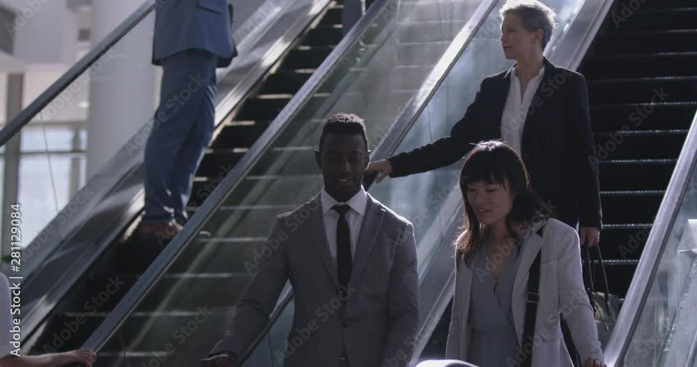 Businesswoman using escalator in a modern office 4k Businesswoman using escalator in a modern office 4k
