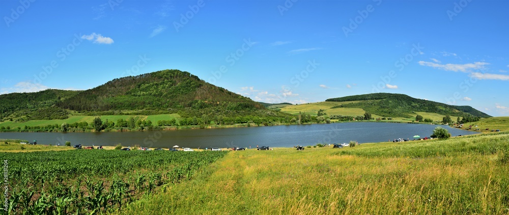 landscape with a lake between the hills
