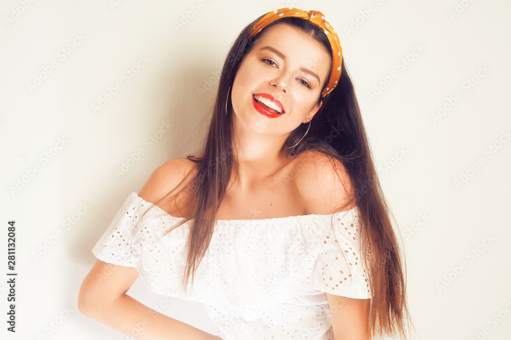 Portrait of a beautiful brunete with long hair. Girl with gold earrings, costume jewelry, dress . Young girl with bandans . Fashion girl in leopard with braces. 