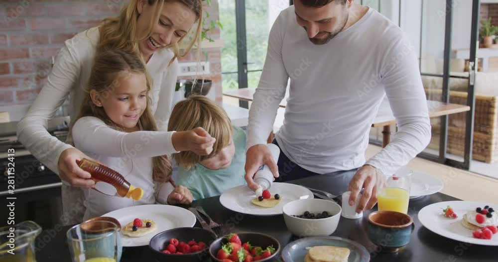 Family garnishing food at dining table in a comfortable home 4k Family garnishing food at dining table in a comfortable home 4k