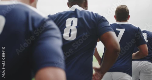Male rugby players running in row at the stadium 4k