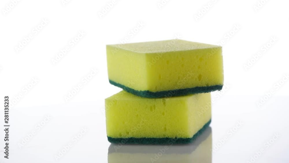Cleaning sponge. Stack of cleaning sponges rotated on white background. Housework. 4K UHD video footage. 3840X2160 Cleaning sponge. Stack of cleaning sponges rotated on white background. Housework. 4K UHD video footage. 3840X2160