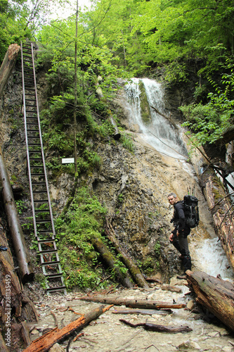 A tourist in the beautiful gorges of the Slovak Paradise National Park photo