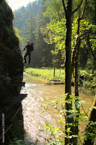 A tourist in the beautiful gorges of the Slovak Paradise National Park photo