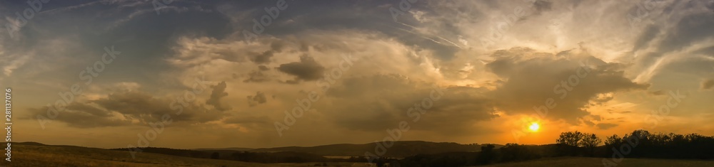 Decaying storm cloud during a sunset at summer evening Decaying storm cloud during a sunset at summer evening
