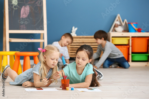 Cute little children painti...