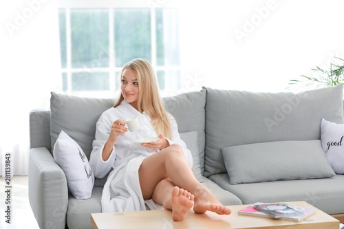 Morning of young woman drin...