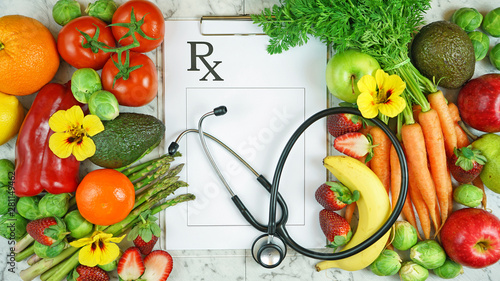 Healthy lifestyle, food is medicine, prescription for good health concept flatlay with colorful fruits and vegetables and clipboard.