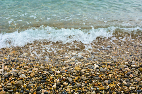 Pebble shore of French Riviera in Nice, natural background