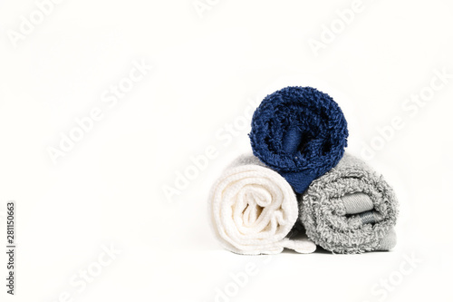 Roll of different towel color on white background.