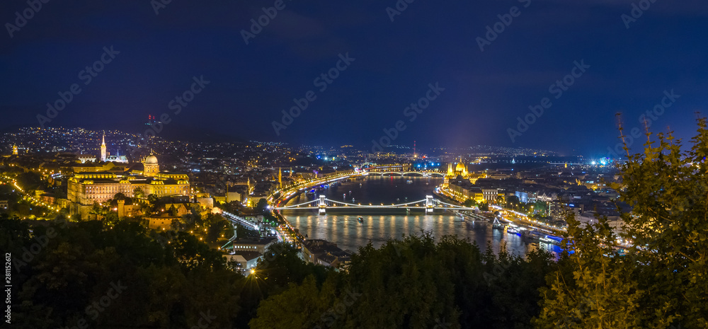 Panoramic view of Budapest Castle and Danube river at night, Hungary.