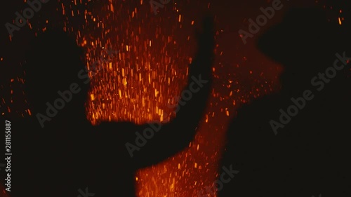 Volcanic Eruption Close Up and Silhouettes of Extreme Traveles on Top of Crater, Slow Motion. Shot on Red Epic Dragon Camera photo