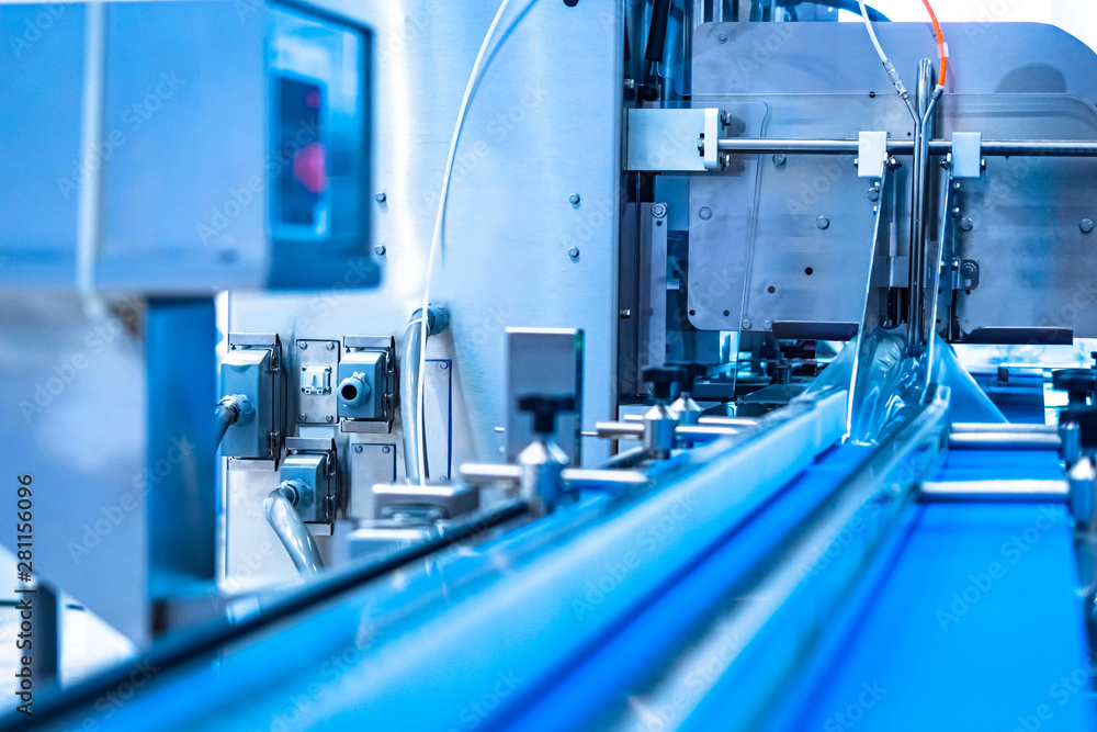 Conveyor for strapping packaging. The pipeline to strengthen the packing tightening belts. Packaging. Tie ribbons to the goods. Industrial equipment. Conveyor for strapping packaging. The pipeline to strengthen the packing tightening belts. Packaging. Tie ribbons to the goods. Industrial equipment.