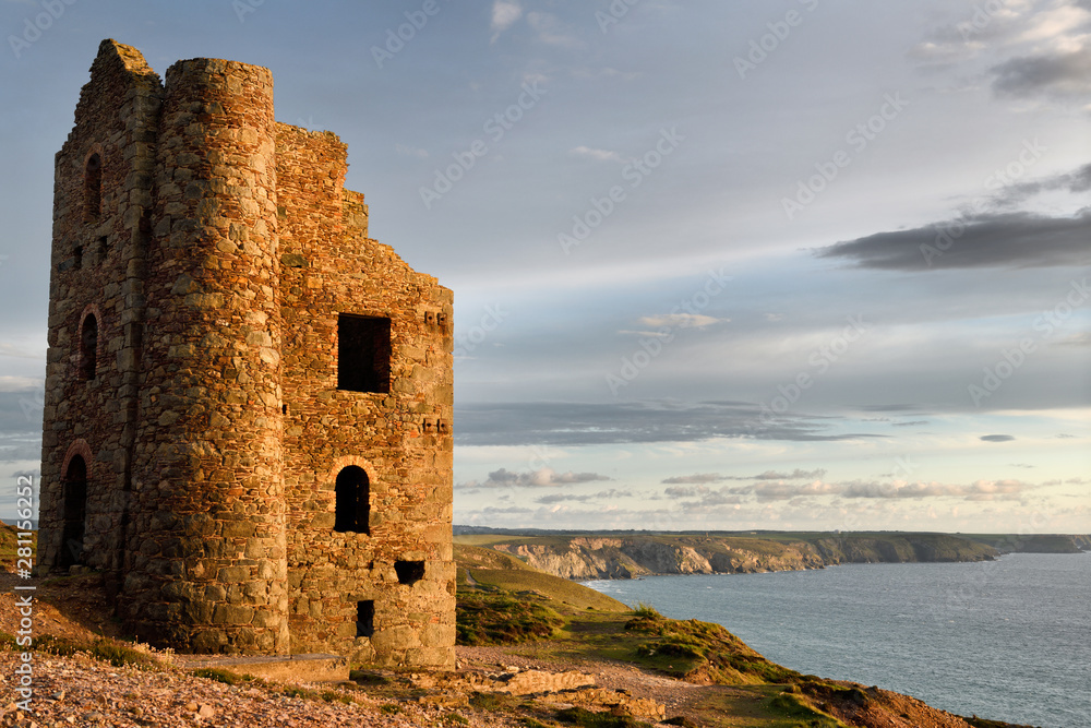 Abandoned Stamps and Whim Engine house at Wheal Coates tine mine on the Celtic Sea Cornwall England with RAF Portreath on clifftops Abandoned Stamps and Whim Engine house at Wheal Coates tine mine on the Celtic Sea Cornwall England with RAF Portreath on clifftops