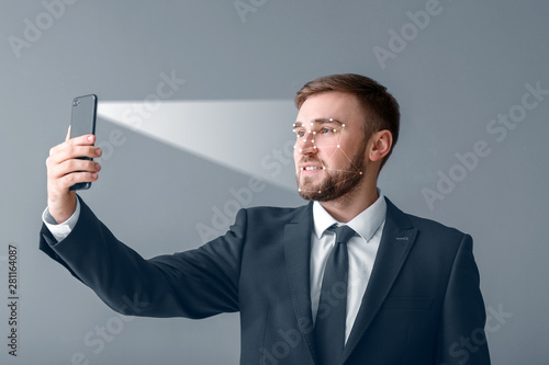 Handsome businessman taking...