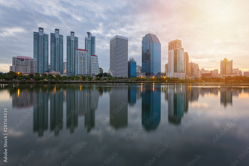 City building with water reflection before sunset