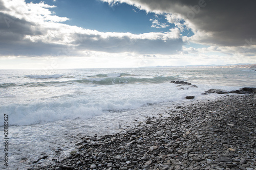 breaking waves on a stony beach