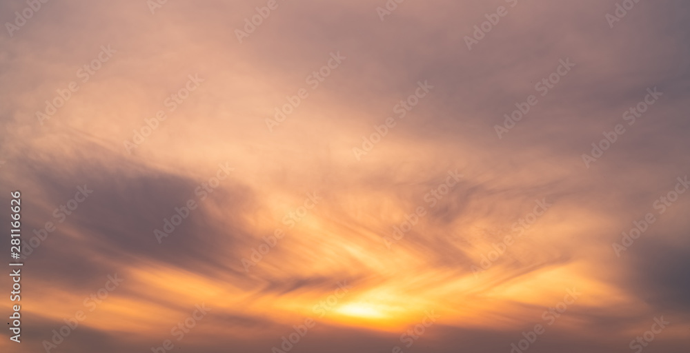 Beautiful sunrise sky. Orange, grey, and white sky. Colorful sunrise. Art picture of sky at sunrise. Sunrise and clouds for inspiration background. Nature background. Peaceful and tranquil concept.