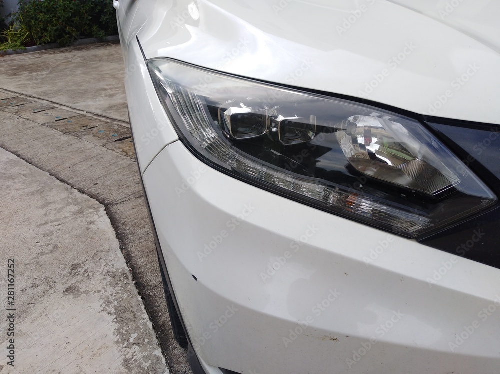 White car front headlight with shallow depth of field