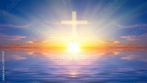 Religious cross against the sunset over the sea, symbolizing the hope of salvation and forgiveness. © Sviatoslav Khomiakov