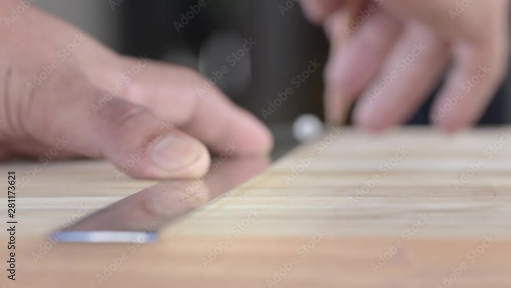 Carpenter use pencil Drawing a Line along the ruler, Pencil draw a line on the wood Carpenter use pencil Drawing a Line along the ruler, Pencil draw a line on the wood