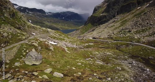 Reveal of mountain road in a valley in the Haukelifjell area in Norway photo