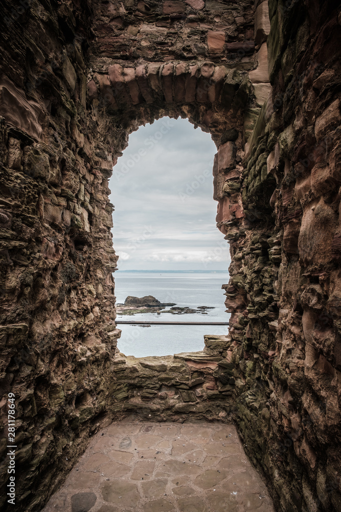 View of sea through window of Tantallon Castle in Scotland