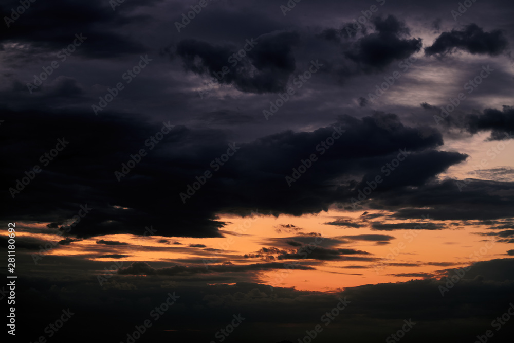 Beautiful sunset - dark sky with clouds and sunlight