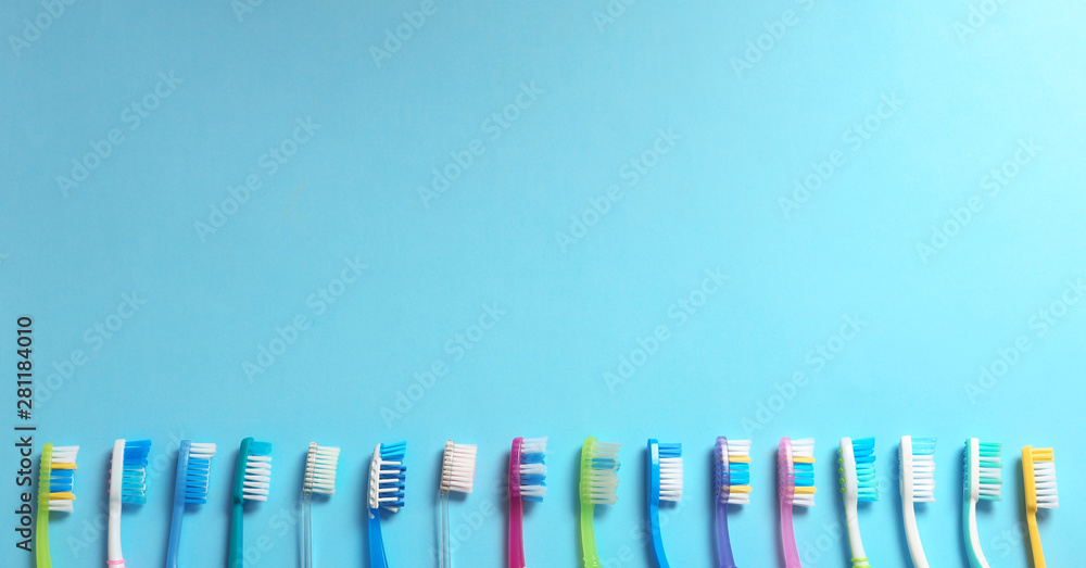 Flat lay composition with toothbrushes on color background. Space for text Flat lay composition with toothbrushes on color background. Space for text