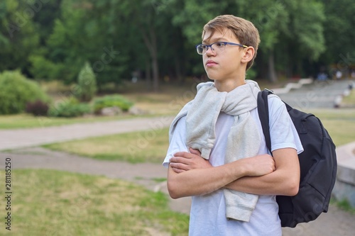 Fototapeta Naklejka Na Ścianę i Meble -  Portrait of teenager schoolboy in glasses with backpack